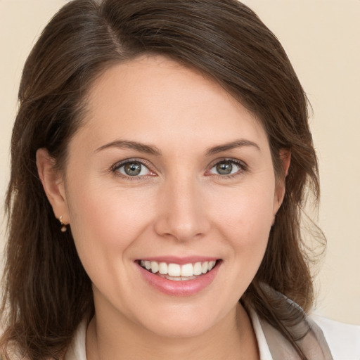 Joyful white young-adult female with medium  brown hair and brown eyes