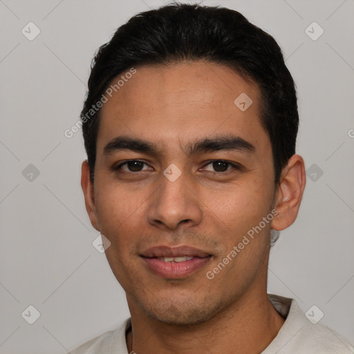 Joyful white young-adult male with short  black hair and brown eyes