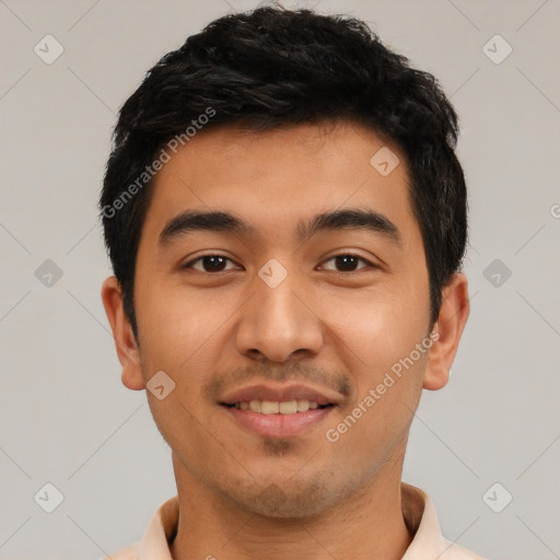 Joyful latino young-adult male with short  black hair and brown eyes