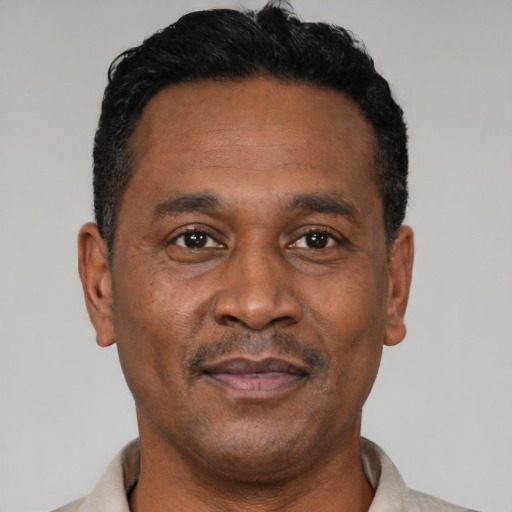 Neutral latino adult male with short  black hair and brown eyes