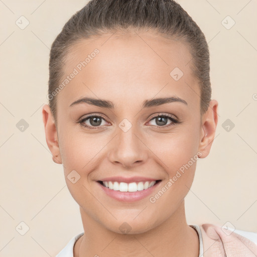 Joyful white young-adult female with short  brown hair and brown eyes