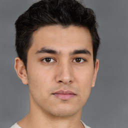 Neutral asian young-adult male with short  brown hair and brown eyes