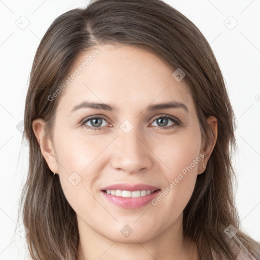 Joyful white young-adult female with long  brown hair and grey eyes