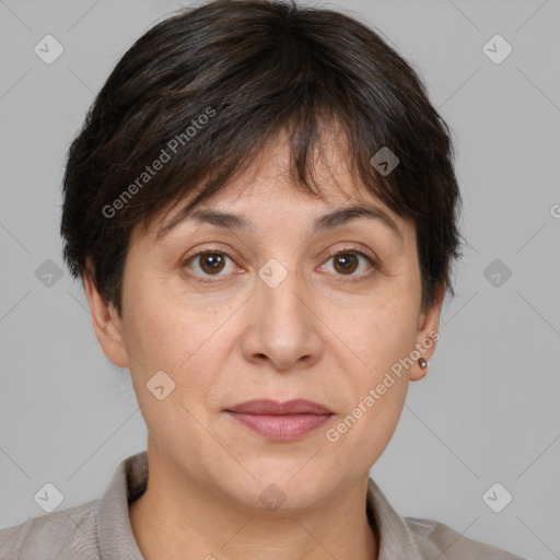 Joyful white adult female with short  brown hair and brown eyes