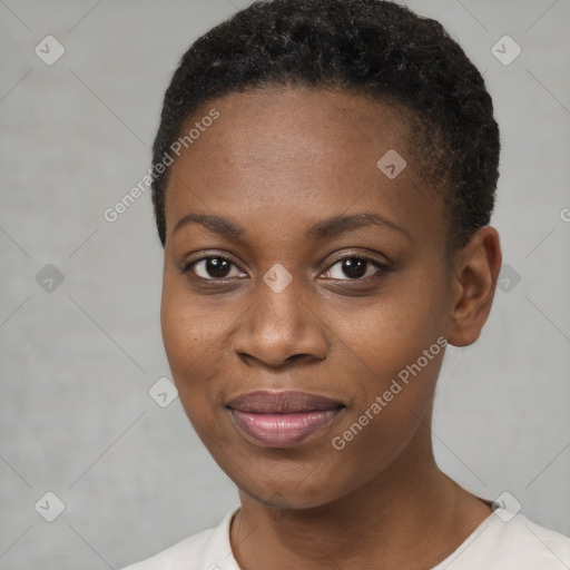 Joyful black young-adult female with short  black hair and brown eyes