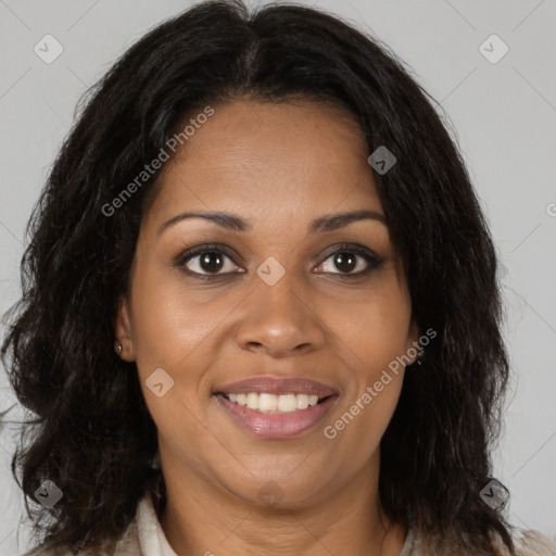 Joyful black adult female with medium  brown hair and brown eyes