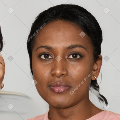 Neutral black young-adult female with medium  black hair and brown eyes