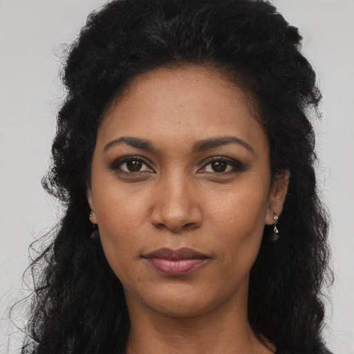 Neutral latino young-adult female with long  black hair and brown eyes