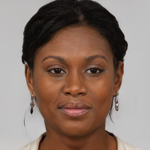 Joyful black young-adult female with medium  brown hair and brown eyes