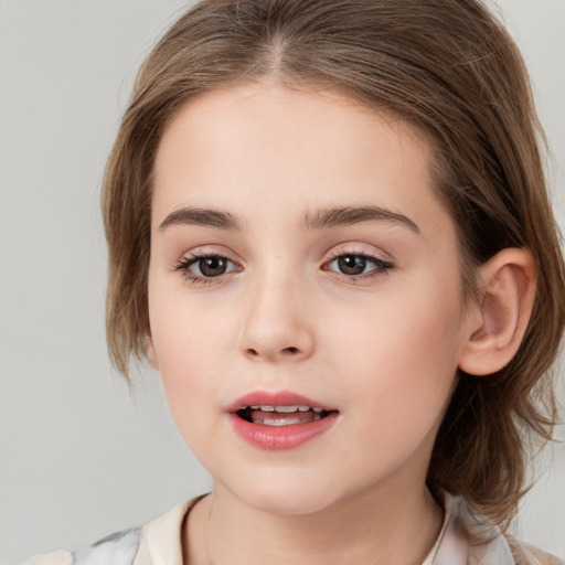 Joyful white child female with medium  brown hair and brown eyes