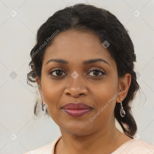 Joyful black young-adult female with medium  brown hair and brown eyes