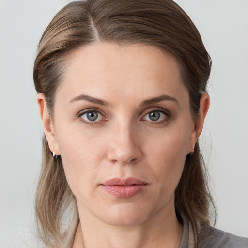 Neutral white young-adult female with medium  brown hair and grey eyes