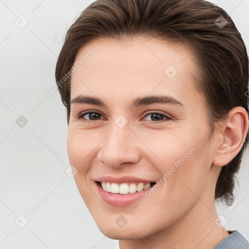 Joyful white young-adult female with medium  brown hair and brown eyes