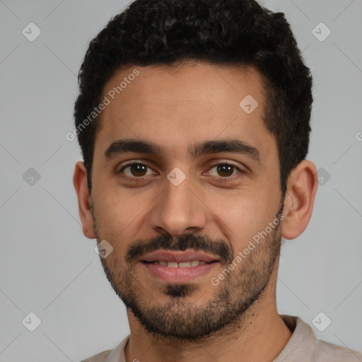 Joyful latino young-adult male with short  black hair and brown eyes