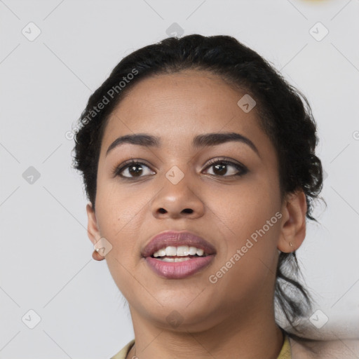 Joyful latino young-adult female with short  black hair and brown eyes