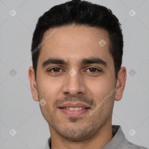 Joyful white young-adult male with short  black hair and brown eyes