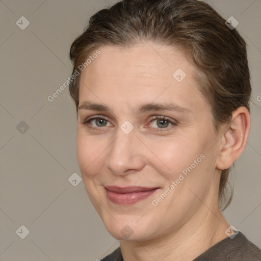 Joyful white adult female with medium  brown hair and grey eyes