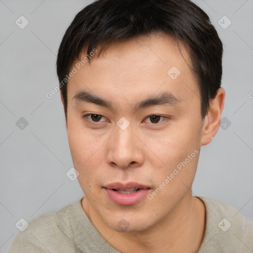 Neutral asian young-adult male with short  brown hair and brown eyes