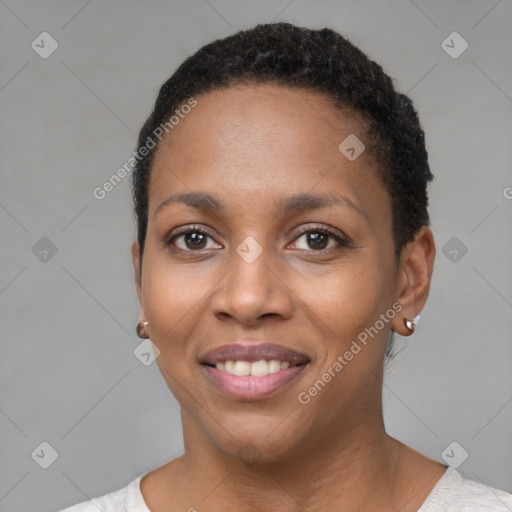 Joyful black young-adult female with short  brown hair and brown eyes