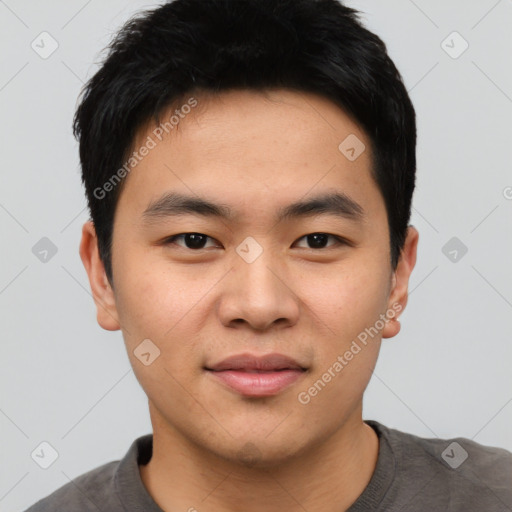 Joyful asian young-adult male with short  black hair and brown eyes