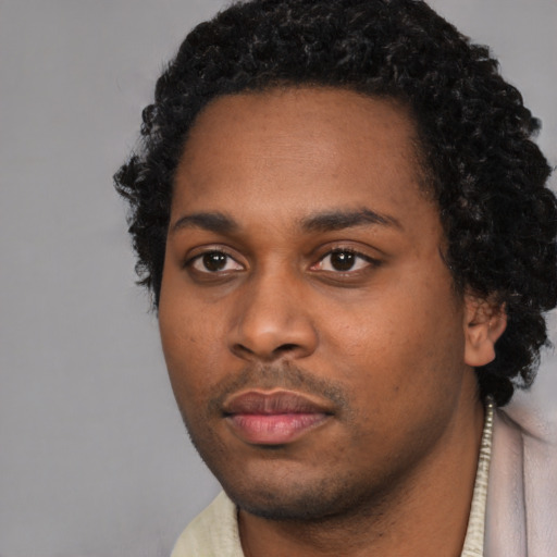 Neutral black young-adult male with short  black hair and brown eyes