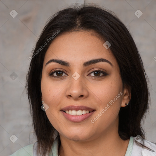 Joyful latino young-adult female with medium  brown hair and brown eyes