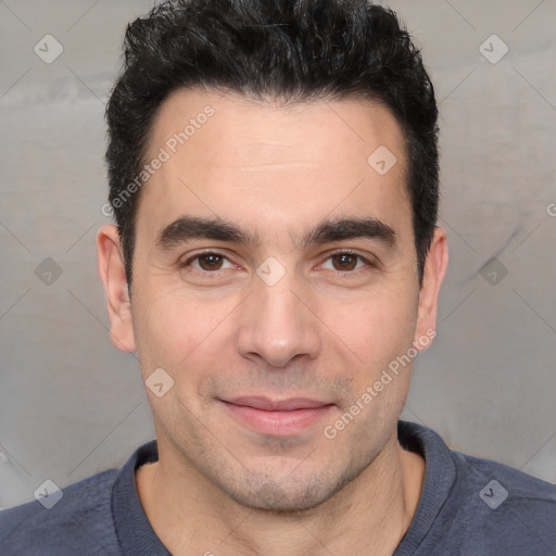 Joyful white young-adult male with short  black hair and brown eyes