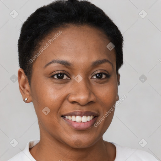 Joyful black young-adult female with short  brown hair and brown eyes