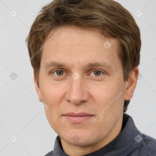 Joyful white adult male with short  brown hair and grey eyes