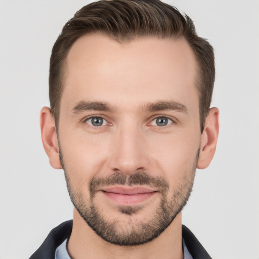 Joyful white young-adult male with short  brown hair and brown eyes