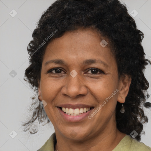 Joyful black adult female with medium  brown hair and brown eyes