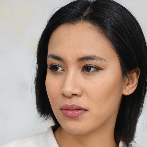 Neutral asian young-adult female with medium  black hair and brown eyes