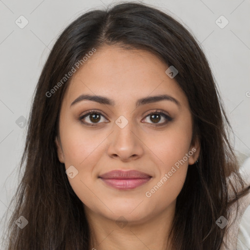 Joyful latino young-adult female with long  brown hair and brown eyes