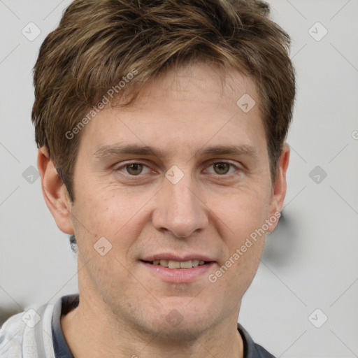 Joyful white adult male with short  brown hair and grey eyes