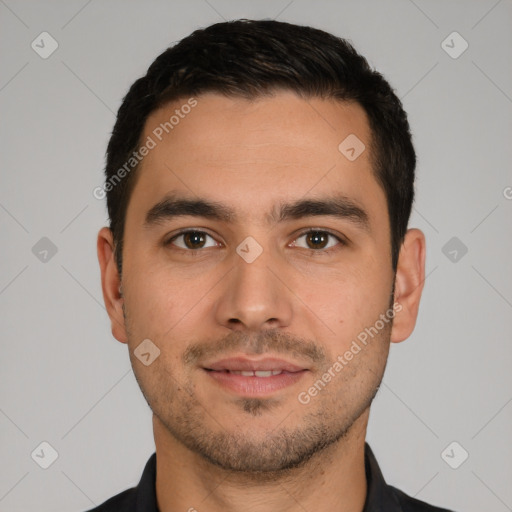 Joyful white young-adult male with short  black hair and brown eyes