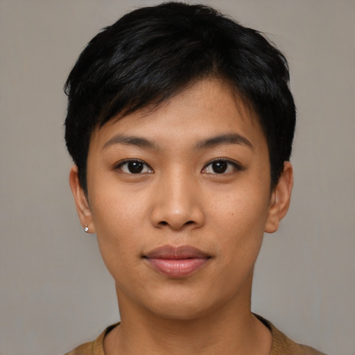 Joyful asian young-adult female with short  black hair and brown eyes