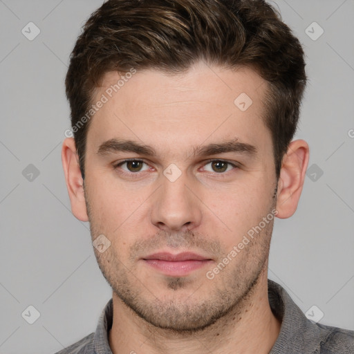 Neutral white young-adult male with short  brown hair and grey eyes