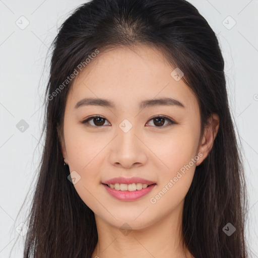 Joyful asian young-adult female with long  brown hair and brown eyes