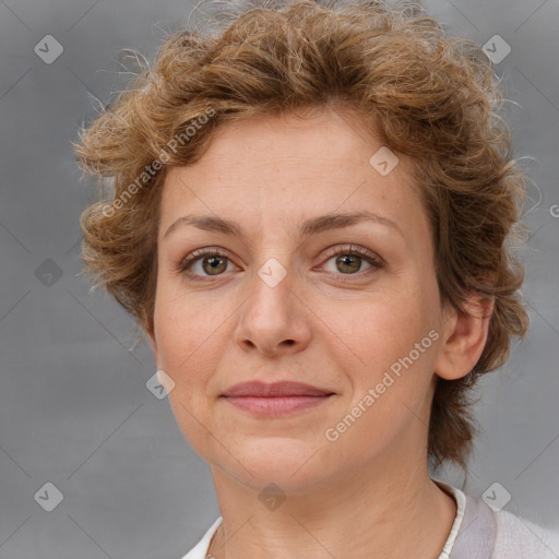 Joyful white adult female with short  brown hair and grey eyes