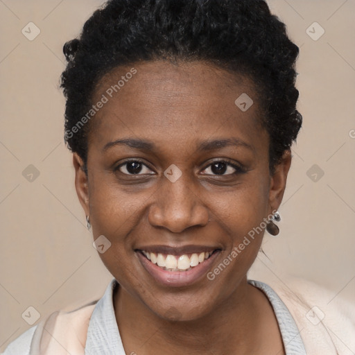 Joyful black young-adult female with short  black hair and brown eyes