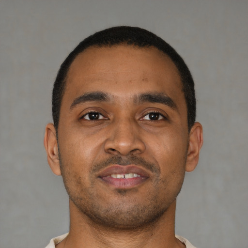 Neutral latino young-adult male with short  brown hair and brown eyes