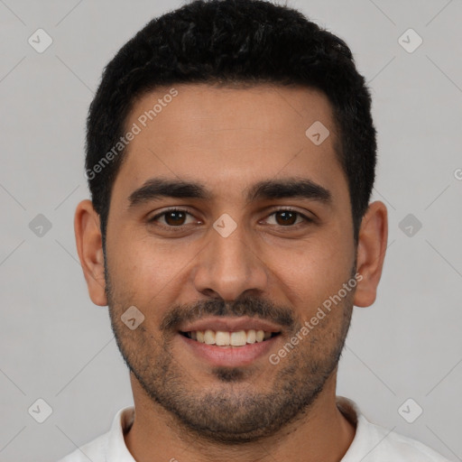 Joyful latino young-adult male with short  black hair and brown eyes