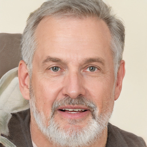 Joyful white middle-aged male with short  gray hair and grey eyes