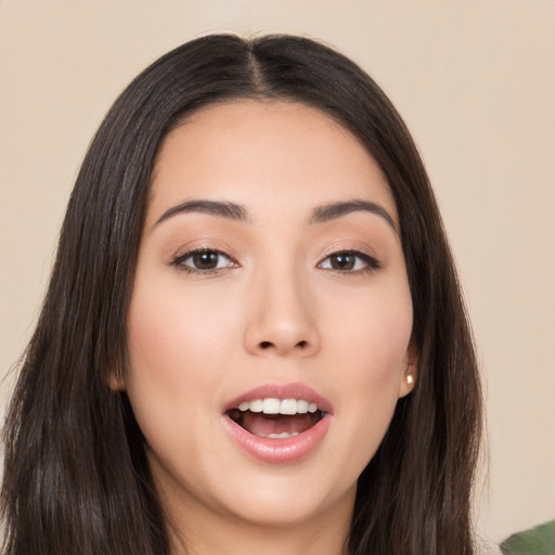 Joyful asian young-adult female with long  brown hair and brown eyes