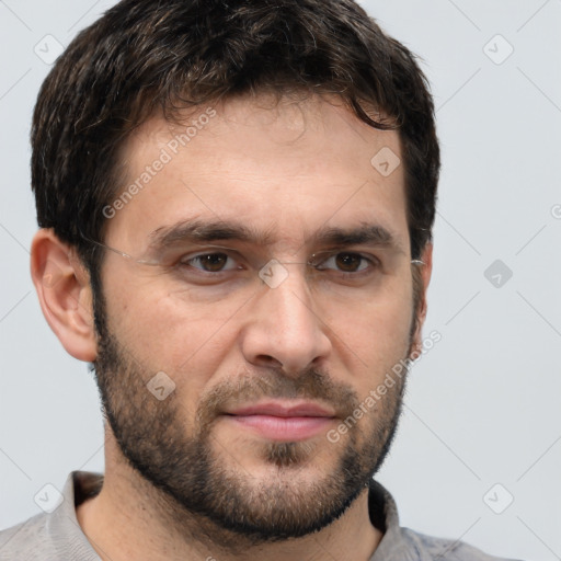 Joyful white adult male with short  brown hair and brown eyes