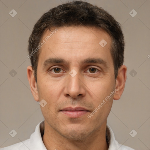 Joyful white adult male with short  brown hair and brown eyes