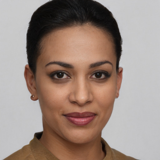 Joyful latino young-adult female with short  brown hair and brown eyes