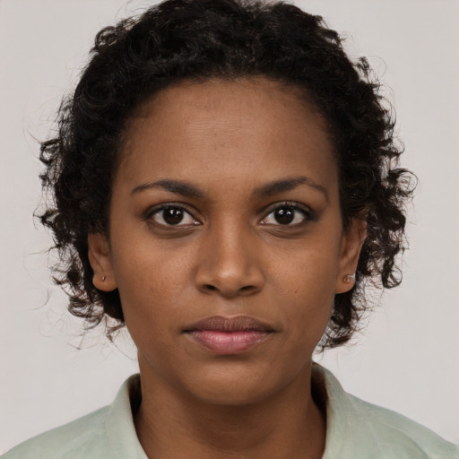 Neutral black young-adult female with short  brown hair and brown eyes