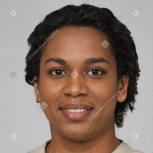 Joyful black young-adult female with short  black hair and brown eyes