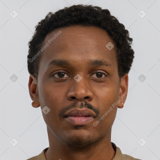 Neutral black young-adult male with short  black hair and brown eyes
